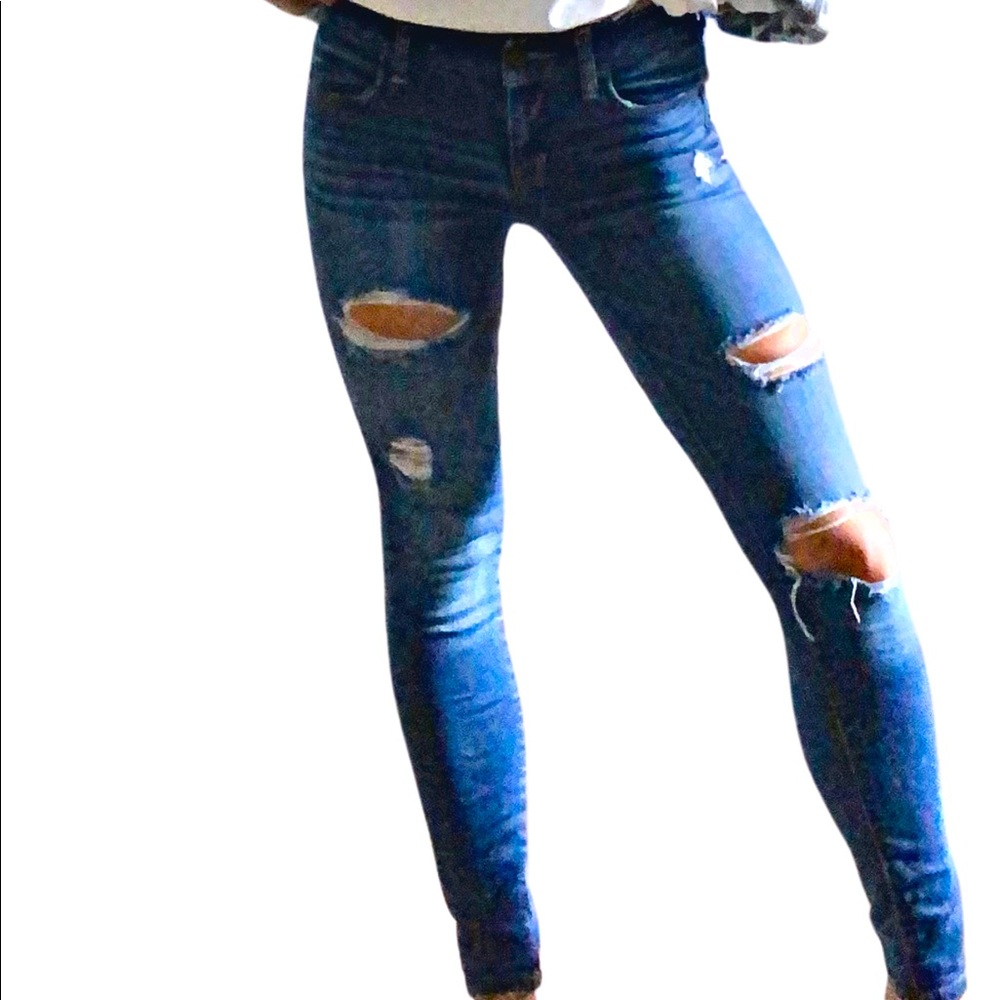 Distressed American Eagle Mid Rise Jegging
